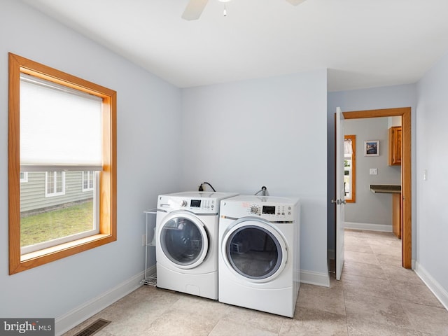 clothes washing area featuring ceiling fan, light tile patterned flooring, and washer and clothes dryer