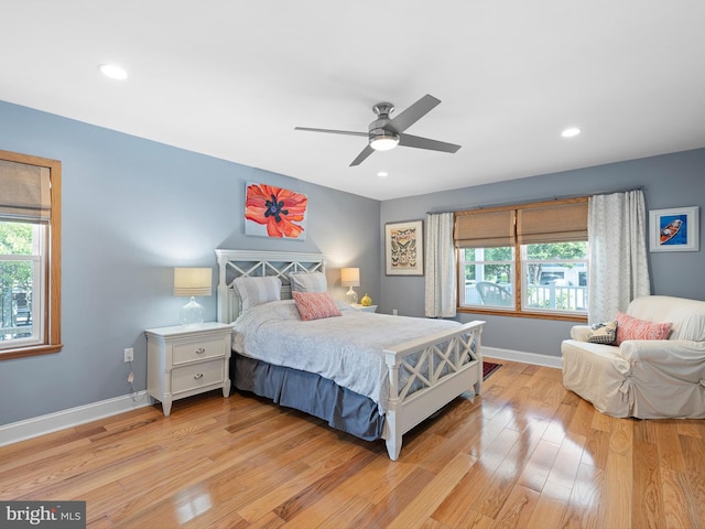 bedroom featuring light hardwood / wood-style flooring and ceiling fan