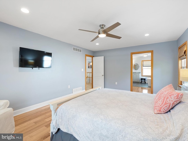 bedroom with light hardwood / wood-style flooring and ceiling fan