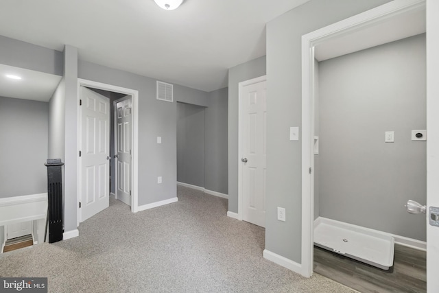 basement with light colored carpet