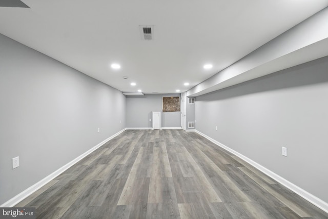 basement featuring hardwood / wood-style flooring