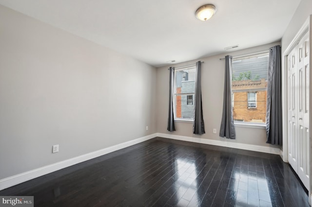 empty room featuring hardwood / wood-style flooring