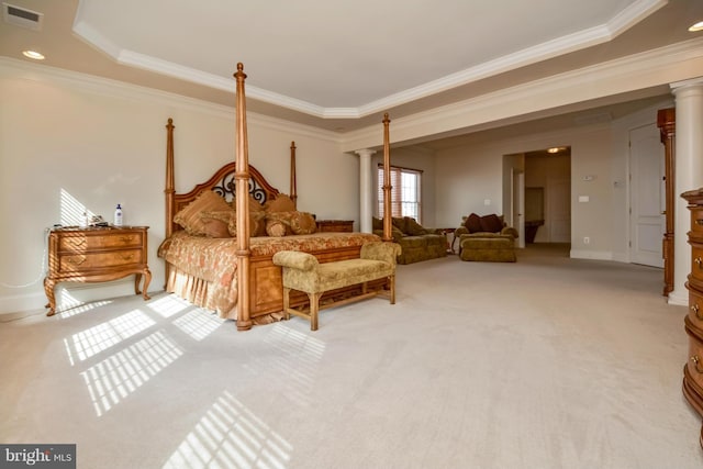 bedroom featuring crown molding, decorative columns, and visible vents