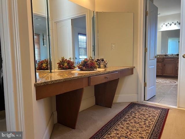 bathroom with baseboards