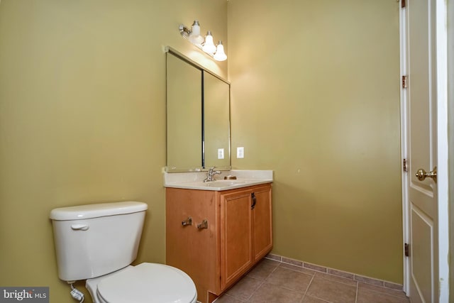 bathroom with tile patterned floors, toilet, and vanity