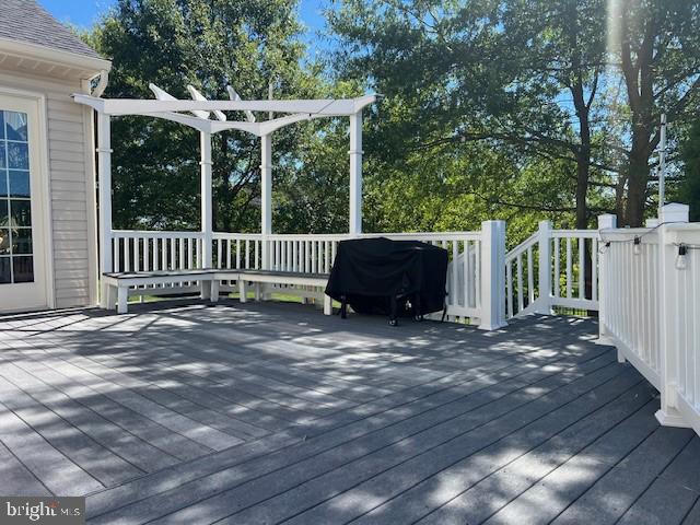 wooden deck featuring area for grilling