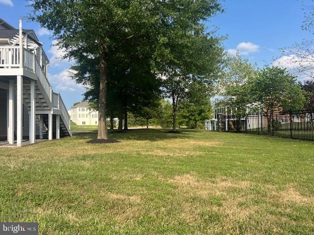 view of yard featuring a wooden deck