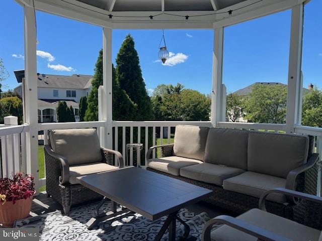 wooden deck featuring outdoor lounge area