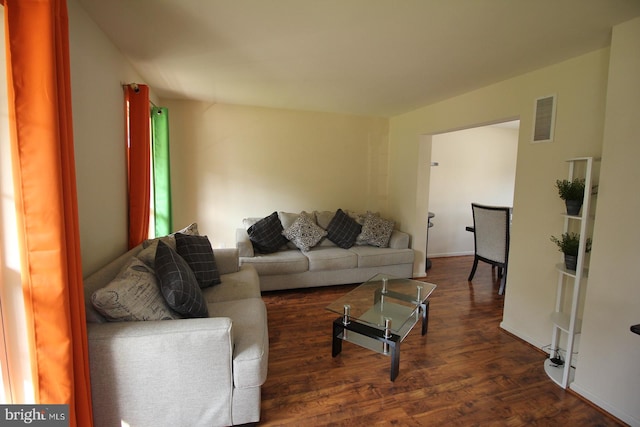 living room with dark hardwood / wood-style floors