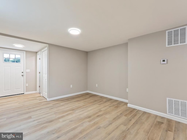 unfurnished room featuring light wood-type flooring