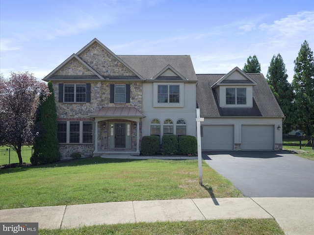 view of front of property with a garage and a front yard