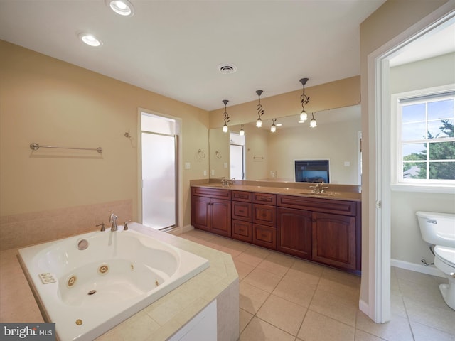 bathroom with tile patterned flooring, tiled bath, toilet, and vanity