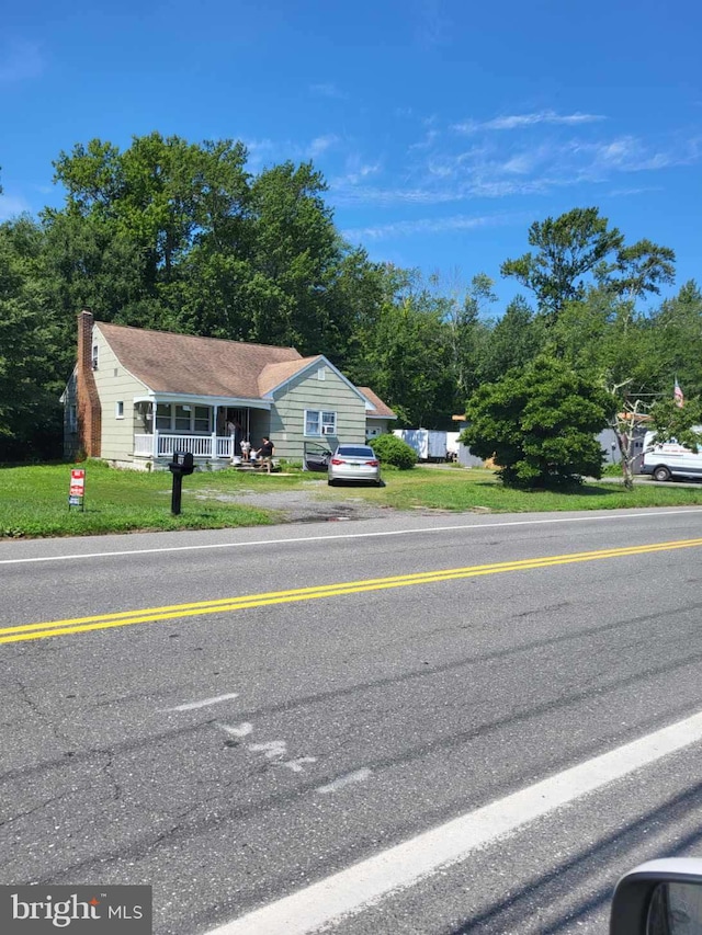 view of front of home with a front lawn and a porch