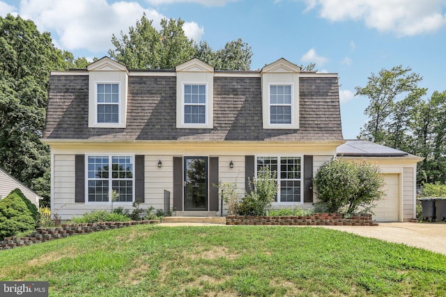 cape cod house featuring a front lawn, solar panels, and a garage