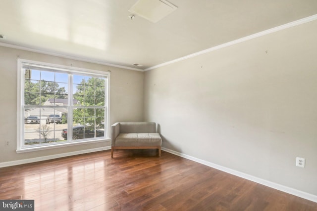 unfurnished room featuring hardwood / wood-style floors and ornamental molding