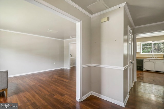 interior space with hardwood / wood-style floors, sink, and ornamental molding