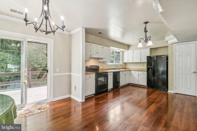 kitchen with decorative light fixtures, white cabinetry, an inviting chandelier, dark hardwood / wood-style floors, and black appliances