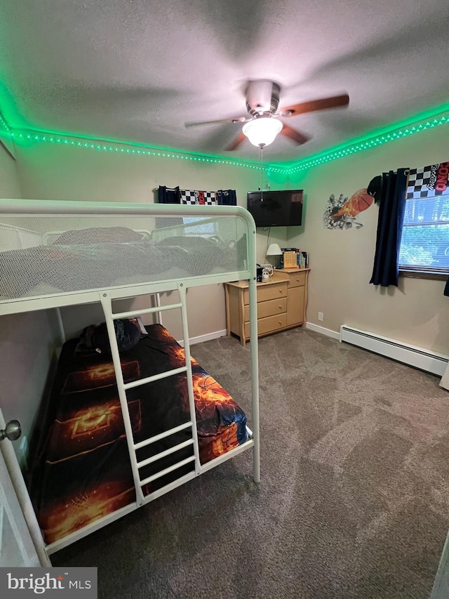 carpeted bedroom featuring ceiling fan, a textured ceiling, and a baseboard radiator