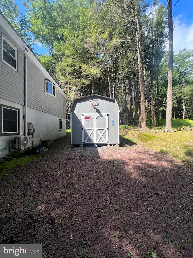 exterior space with a shed