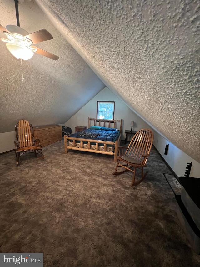 carpeted bedroom featuring a textured ceiling, lofted ceiling, and ceiling fan