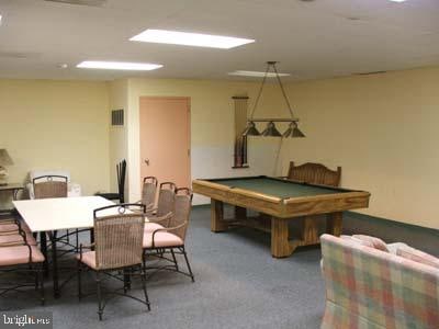 rec room with dark colored carpet and billiards