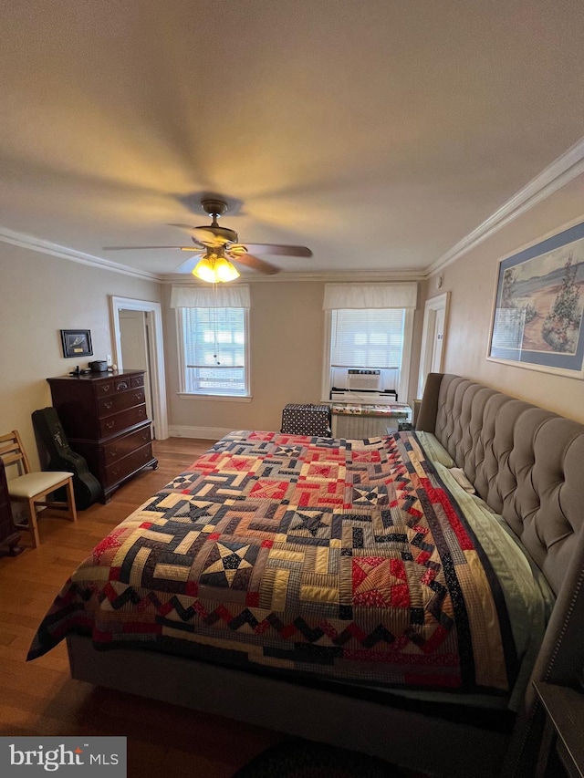 bedroom featuring cooling unit, crown molding, ceiling fan, and wood finished floors