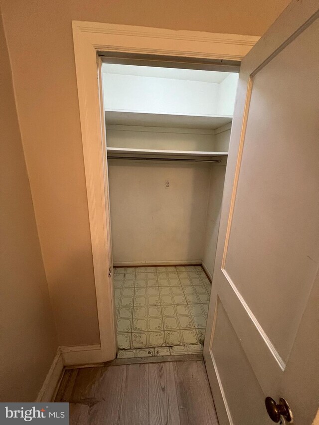 kitchen with sink, stainless steel dishwasher, and light stone countertops