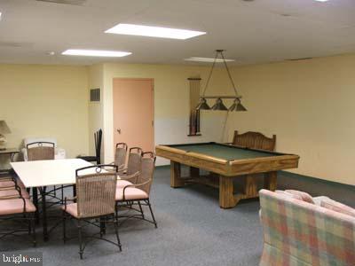 game room with billiards, carpet, and visible vents