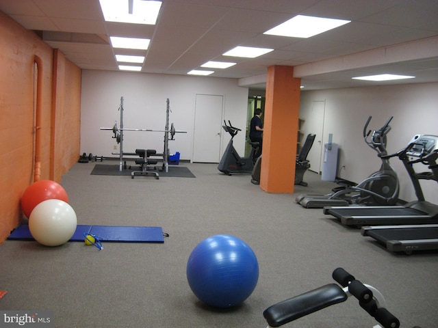 exercise room featuring a paneled ceiling