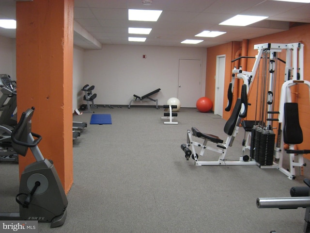 workout area featuring a drop ceiling