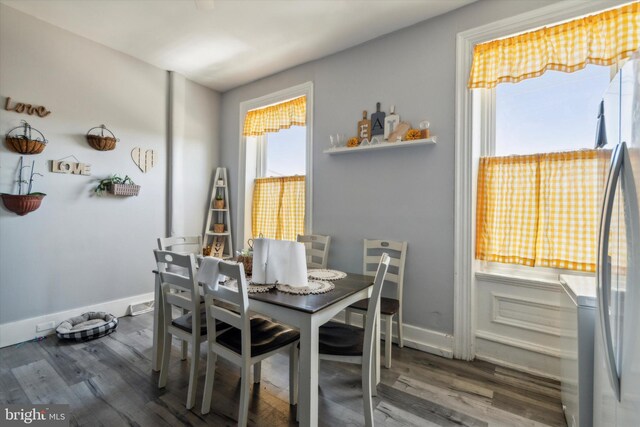 dining area with hardwood / wood-style flooring