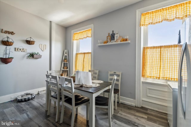 dining space featuring dark wood-type flooring