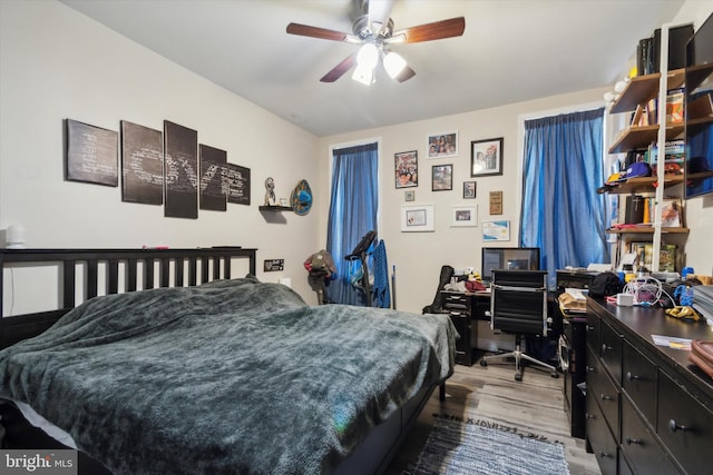 bedroom featuring ceiling fan and light hardwood / wood-style flooring