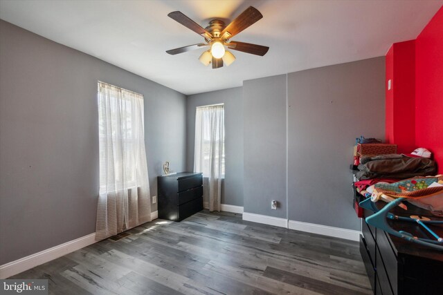 misc room featuring ceiling fan and dark hardwood / wood-style flooring