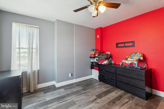 bedroom featuring ceiling fan and hardwood / wood-style floors