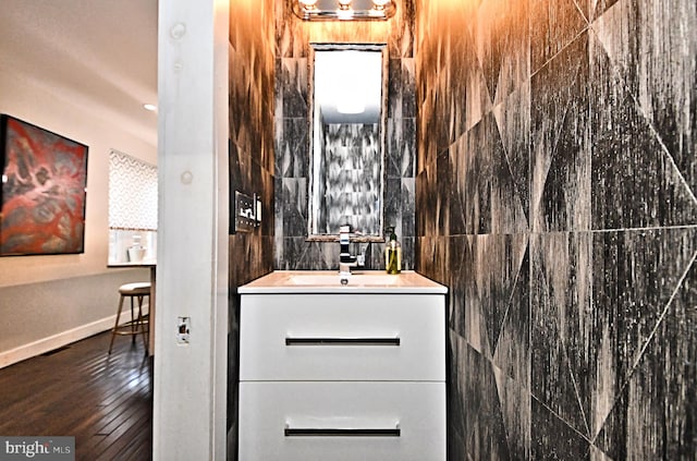 bathroom featuring wood-type flooring and vanity