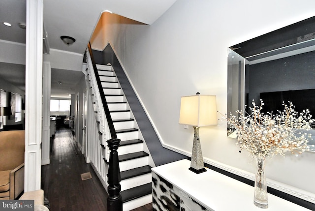 stairs with hardwood / wood-style flooring