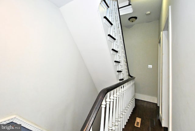 stairway featuring hardwood / wood-style flooring