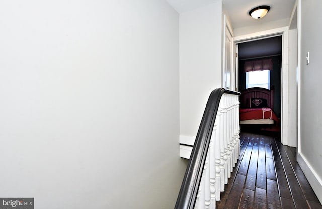 hall with dark hardwood / wood-style flooring