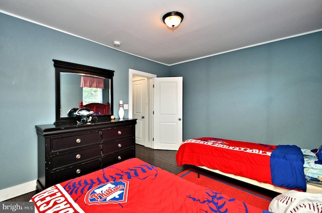 bedroom featuring dark wood-type flooring