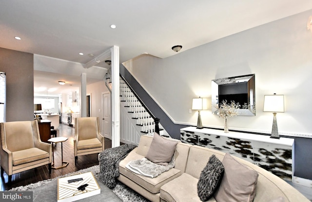 living room with dark hardwood / wood-style flooring