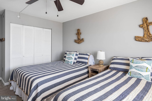 carpeted bedroom featuring a closet and ceiling fan