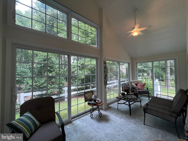 sunroom / solarium with lofted ceiling and ceiling fan