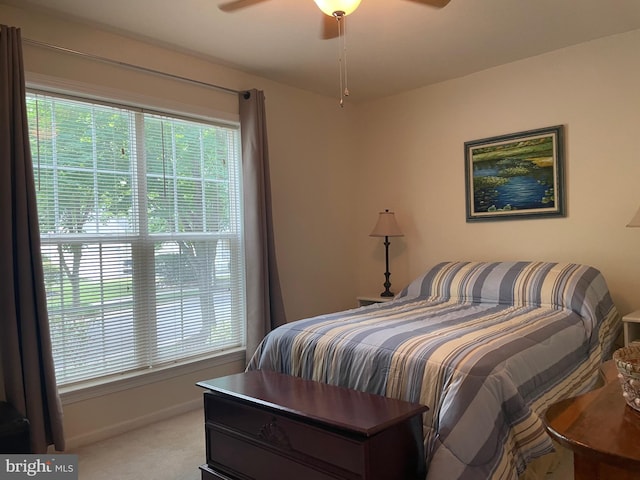 bedroom with ceiling fan and carpet