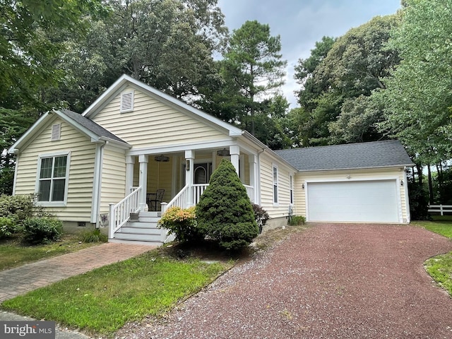 bungalow featuring a garage and covered porch