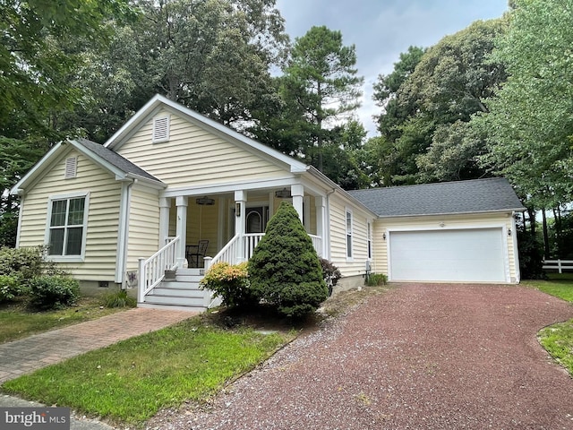 view of front of property with an attached garage, covered porch, a shingled roof, dirt driveway, and crawl space