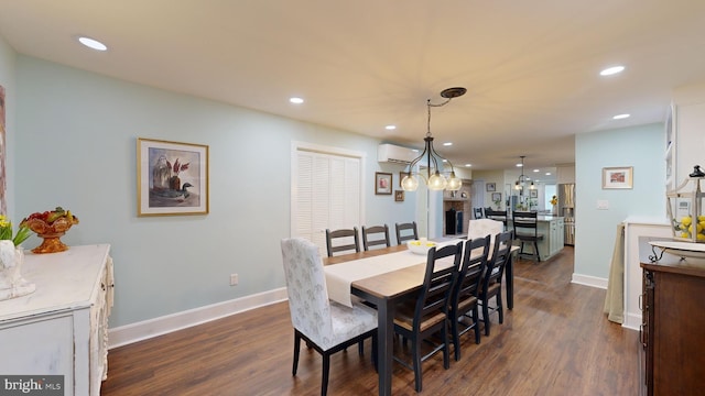 dining space featuring an AC wall unit and dark wood-type flooring