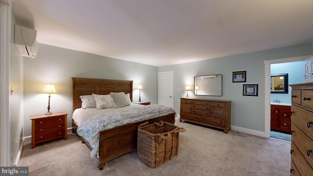 carpeted bedroom featuring a wall unit AC, sink, and connected bathroom