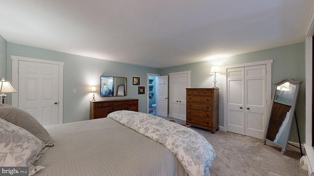 bedroom featuring light colored carpet