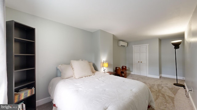 carpeted bedroom featuring a closet and a wall mounted air conditioner